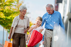 grandparents and child shopping outdoors