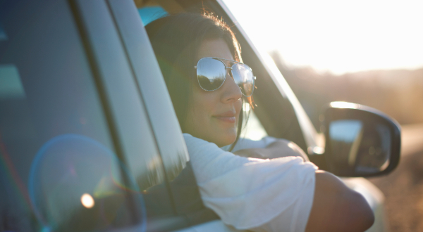 woman looking out the car window