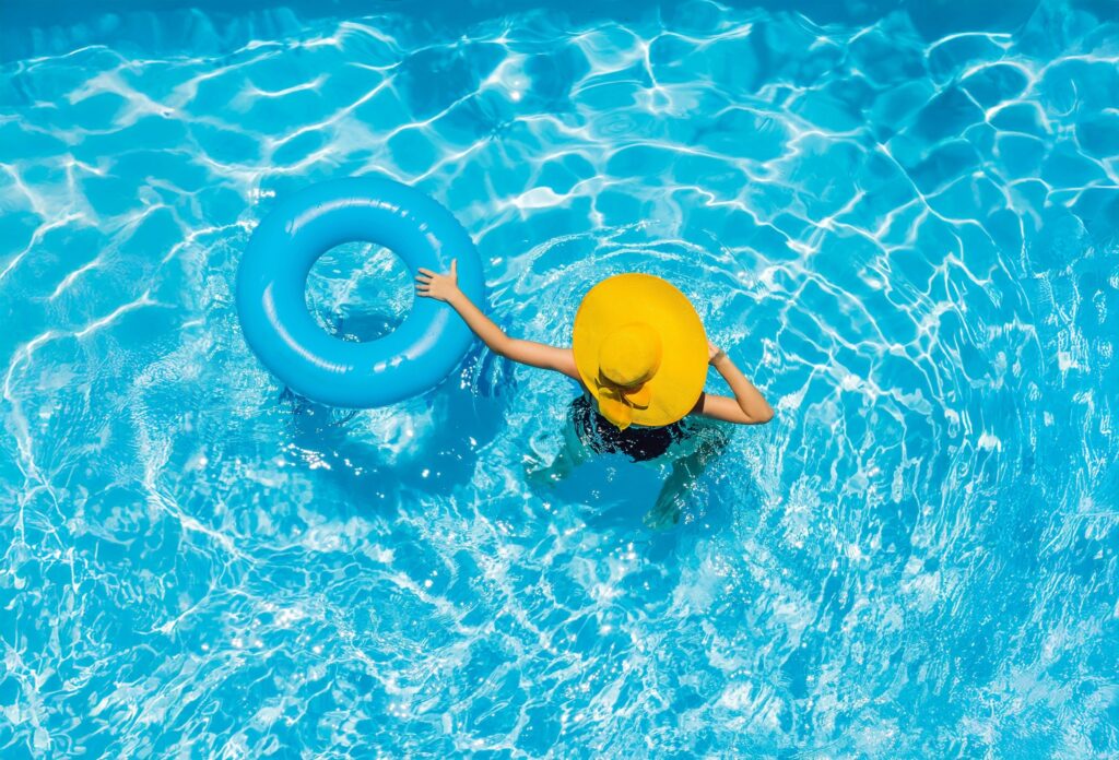 woman in the pool with a floatie