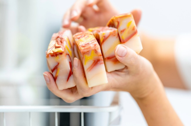 person holding homemade soap